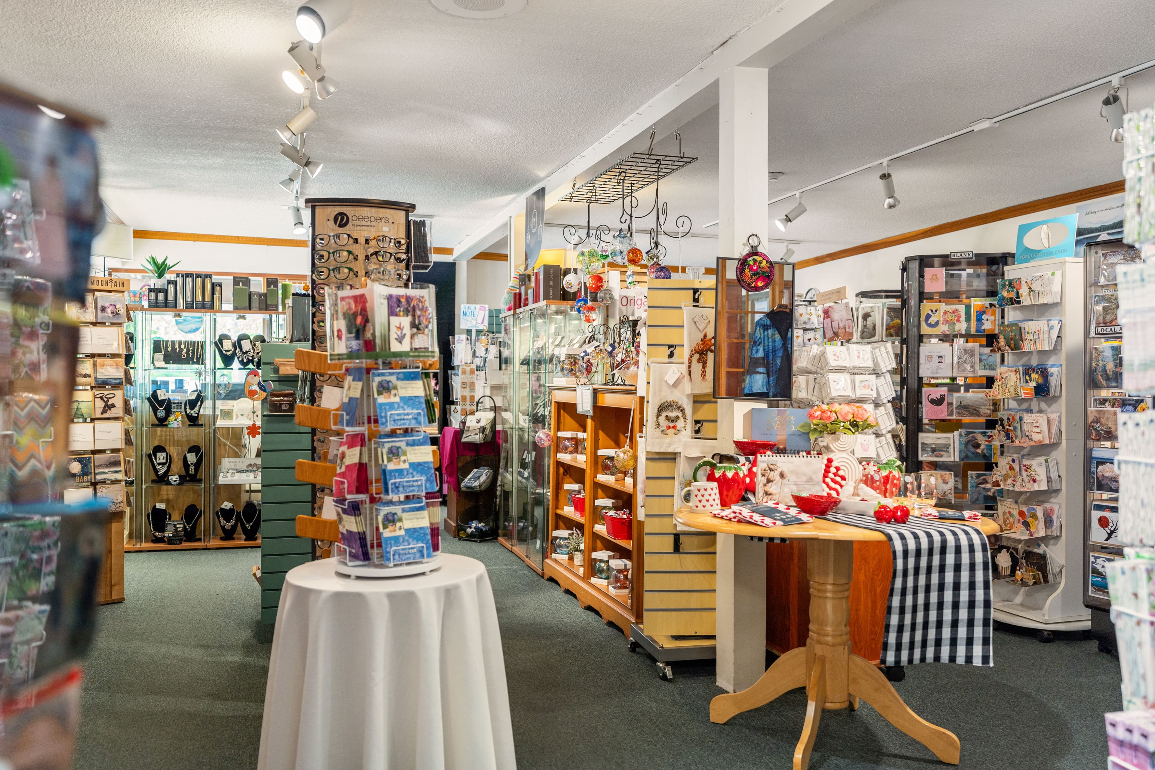 Wide interior view across jewellery, gifts and card racks