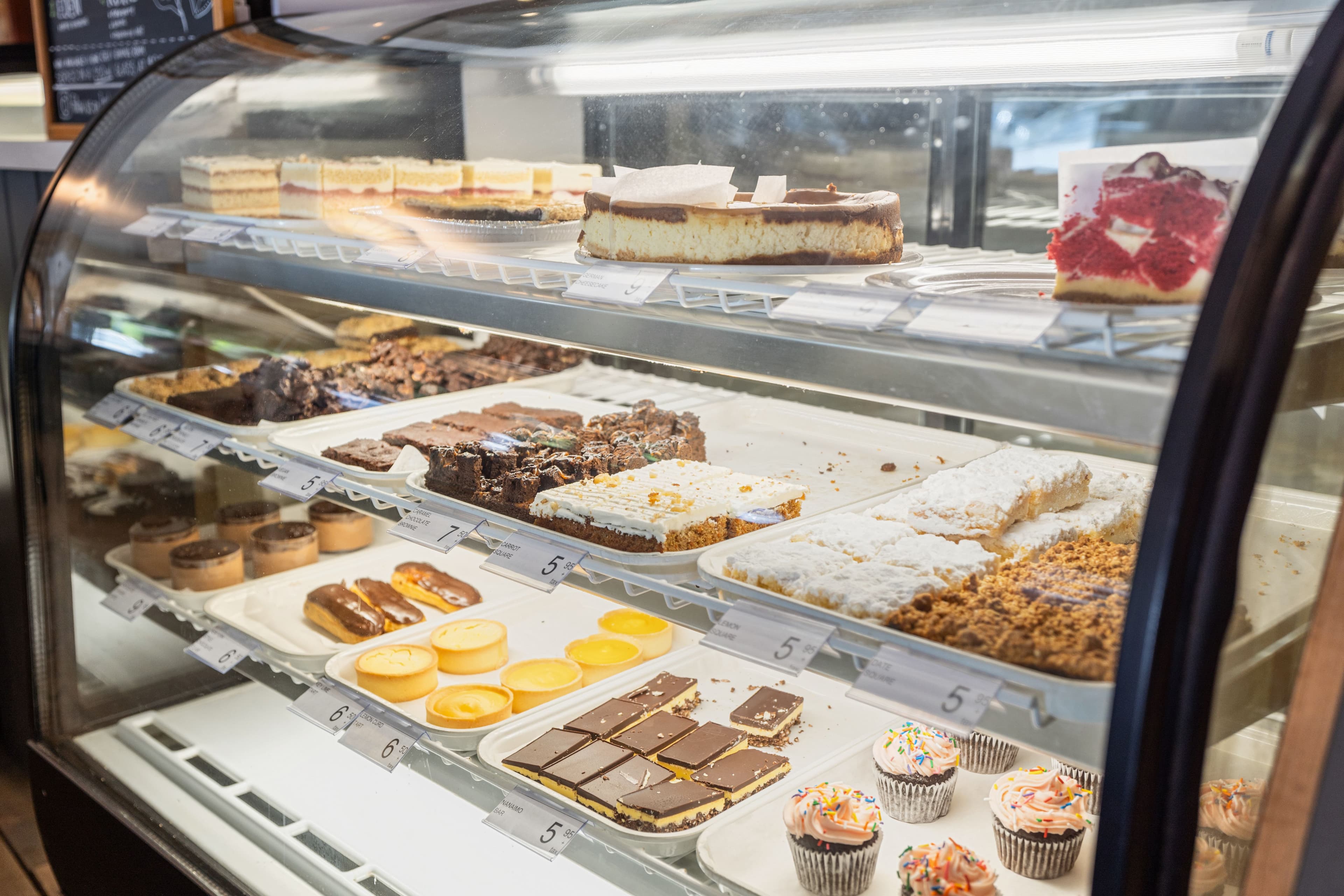 Bakery display case full of cakes, tarts and pastries