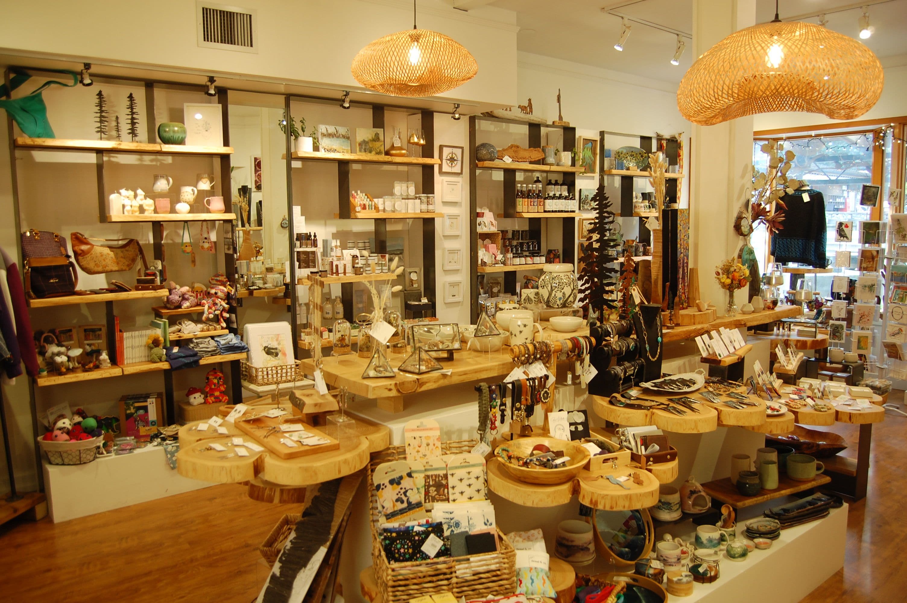 Wide view of Market Collective with shelves of ceramics, baskets and curated goods
