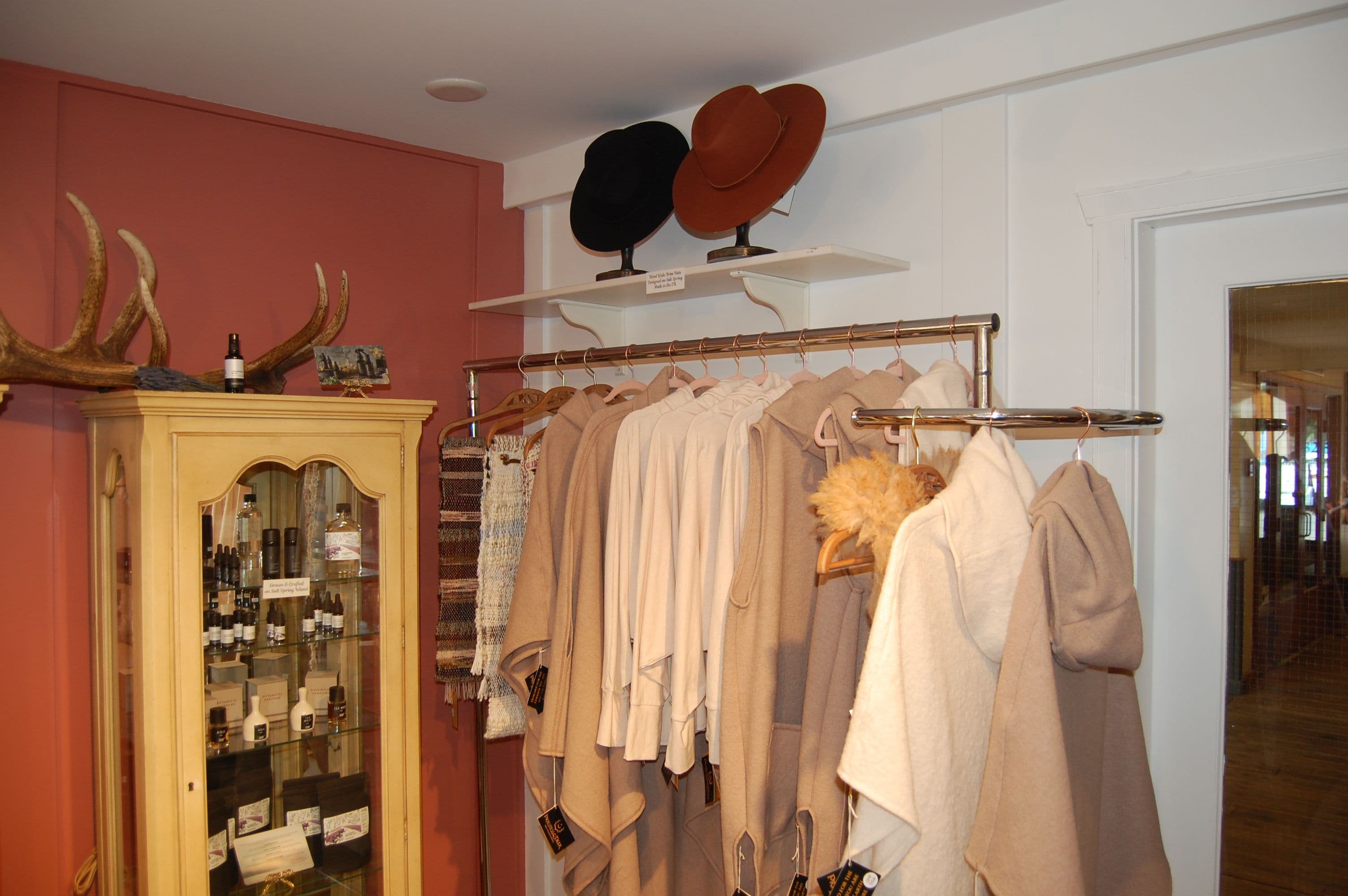 Black and brown wide-brim hats on display stands