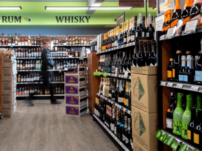 Whisky and rum aisle with bottles flanking the walkway